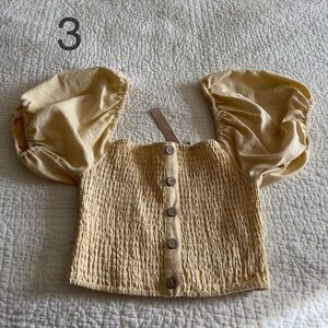 Yellow body fitting blouse with puffy sleeves, size S